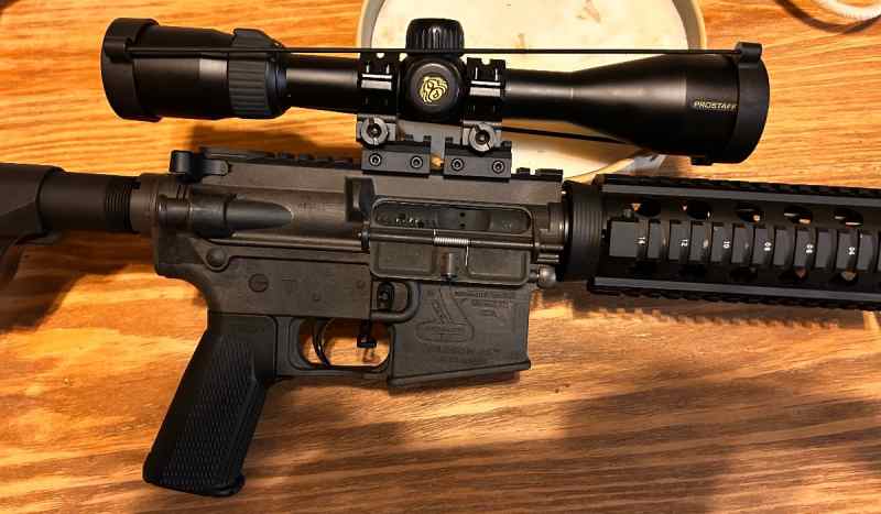 Bushmaster ultra light Carbon 15 5.56 rifle w/scop