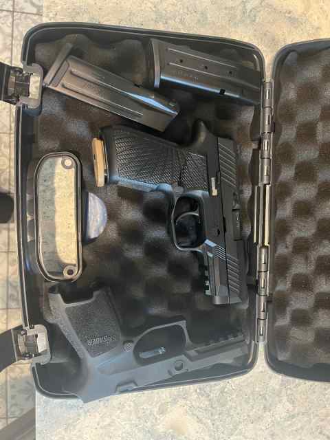 Sig Sauer p320 9mm with Wilson Combat xtra mags