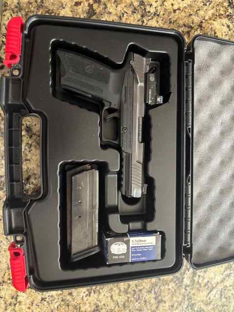 Ruger 5.7 with a venom red dot 